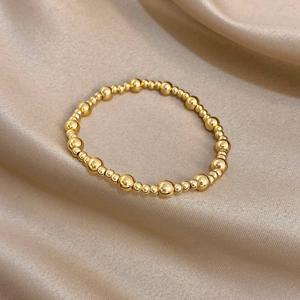 Pulsera de cuentas de acero inoxidable Greatera – Pulsera de cadena elástica tricolor bañada en oro de 3/4 mm para mujer | Regalo de joyería de moda impermeable