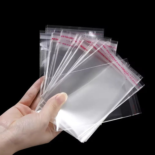100 bolsas autoadhesivas transparentes de OPP – Bolsas de plástico transparentes resellables para ropa, joyas, galletas, dulces y envoltorio de regalos