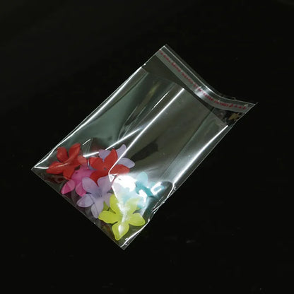 100 bolsas de plástico transparentes autosellables – Bolsas de embalaje adhesivas transparentes para joyas, dulces, galletas y pequeños regalos