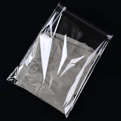StoBag 100 sacs auto-scellants transparents pour vêtements – Sacs d'emballage en plastique transparent avec fermeture adhésive pour t-shirts, cadeaux, mariages et fêtes