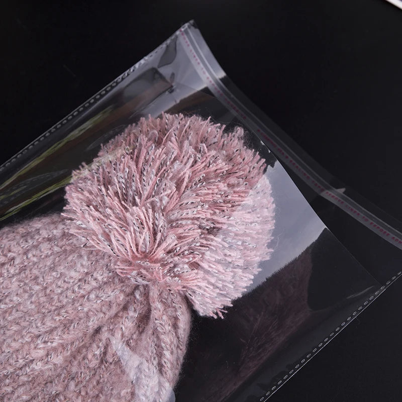 StoBag 100 sacs auto-scellants transparents pour vêtements – Sacs d'emballage en plastique transparent avec fermeture adhésive pour t-shirts, cadeaux, mariages et fêtes