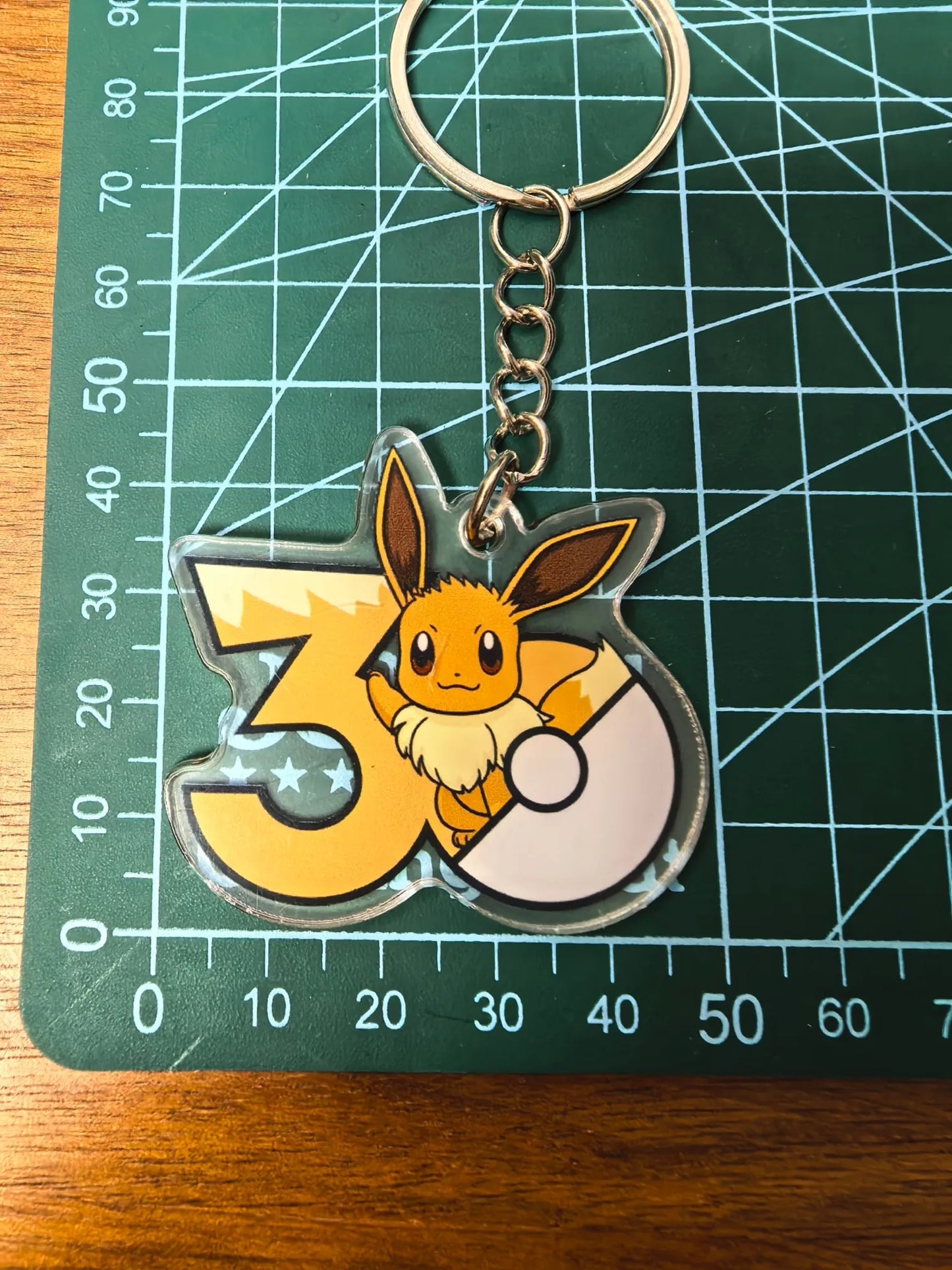 Pokémon 30th Anniversary Acrylic Keychain – Captain Pikachu, Eevee & Eeveelutions (50 Styles)