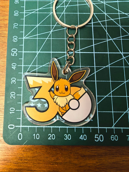 Pokémon 30th Anniversary Acrylic Keychain – Captain Pikachu, Eevee & Eeveelutions (50 Styles)