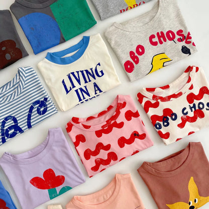 Camiseta de algodón con dibujos animados para niños 2025 – Top de manga corta estilo coreano de primavera-verano para bebés niños y niñas, ropa exterior informal para uso diario.