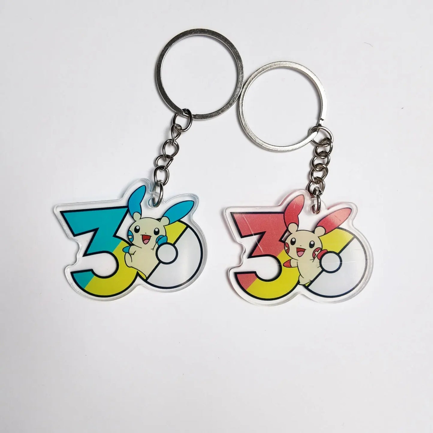 Pokémon 30th Anniversary Acrylic Keychain – Captain Pikachu, Eevee & Eeveelutions (50 Styles)