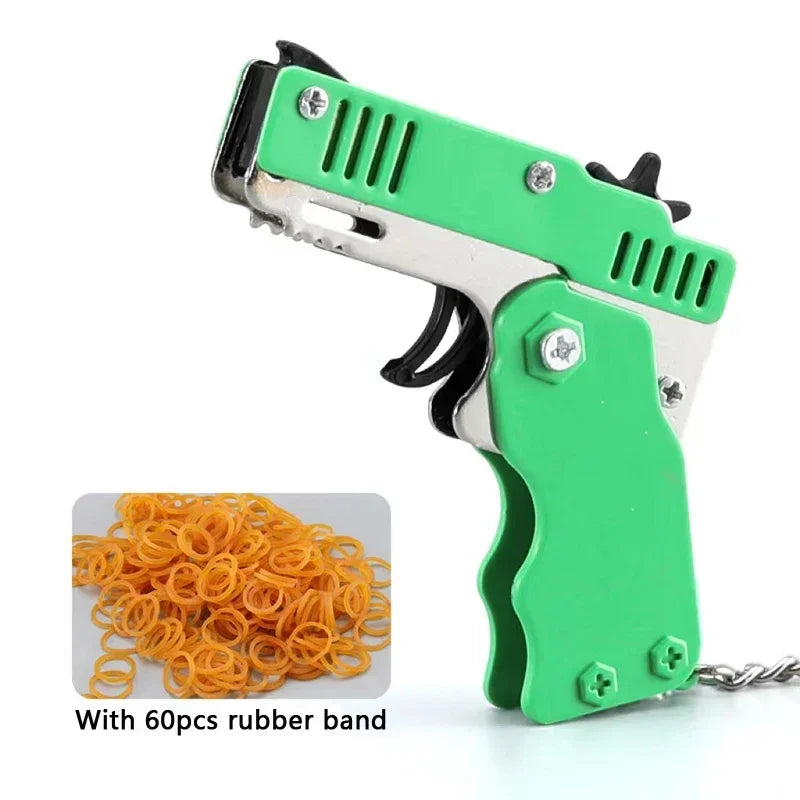 Llavero de pistola de goma de metal - Mini pistola de juguete de aleación con 60 gomas elásticas para juegos al aire libre, diversión en fiestas y regalos