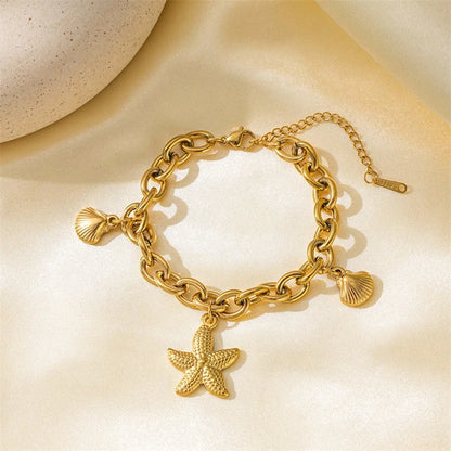 Pulsera de acero inoxidable 316L con dijes de estrellas de mar, luna y estrellas doradas – Cadena de muñeca moderna para mujer, regalo de joyería para fiestas