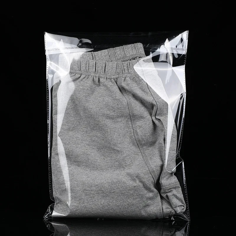 StoBag 100 sacs auto-scellants transparents pour vêtements – Sacs d'emballage en plastique transparent avec fermeture adhésive pour t-shirts, cadeaux, mariages et fêtes