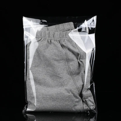 StoBag 100 sacs auto-scellants transparents pour vêtements – Sacs d'emballage en plastique transparent avec fermeture adhésive pour t-shirts, cadeaux, mariages et fêtes