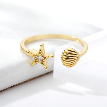 Gold Stainless Steel Starfish & Shell Ring – Adjustable Waterproof Beach-Inspired Ring for Women