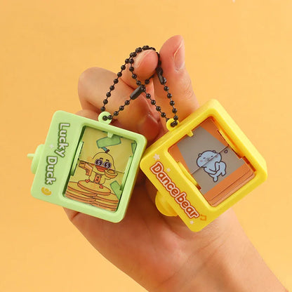 Cartoon Book Flipping Animation Machine Keychain – Creative Backpack Pendant Decompression Fidget Toy, Novelty Small Gift