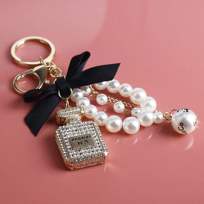 Imitation Pearl Perfume Bottle Keychain – Cute Bow Car Key Ring & Fashion Bag Charm Accessory for Women and Girls