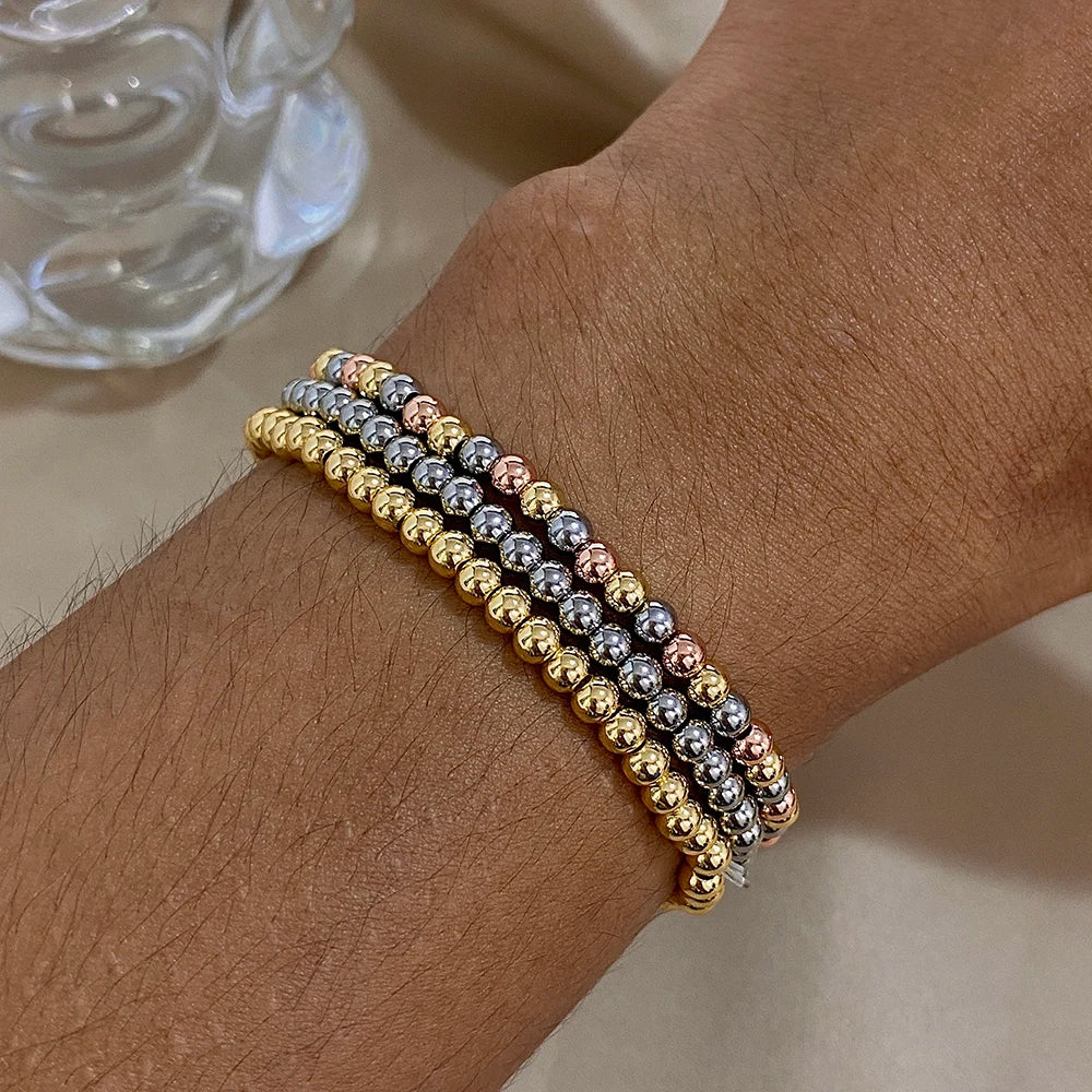 Pulsera de cuentas de acero inoxidable Greatera – Pulsera de cadena elástica tricolor bañada en oro de 3/4 mm para mujer | Regalo de joyería de moda impermeable