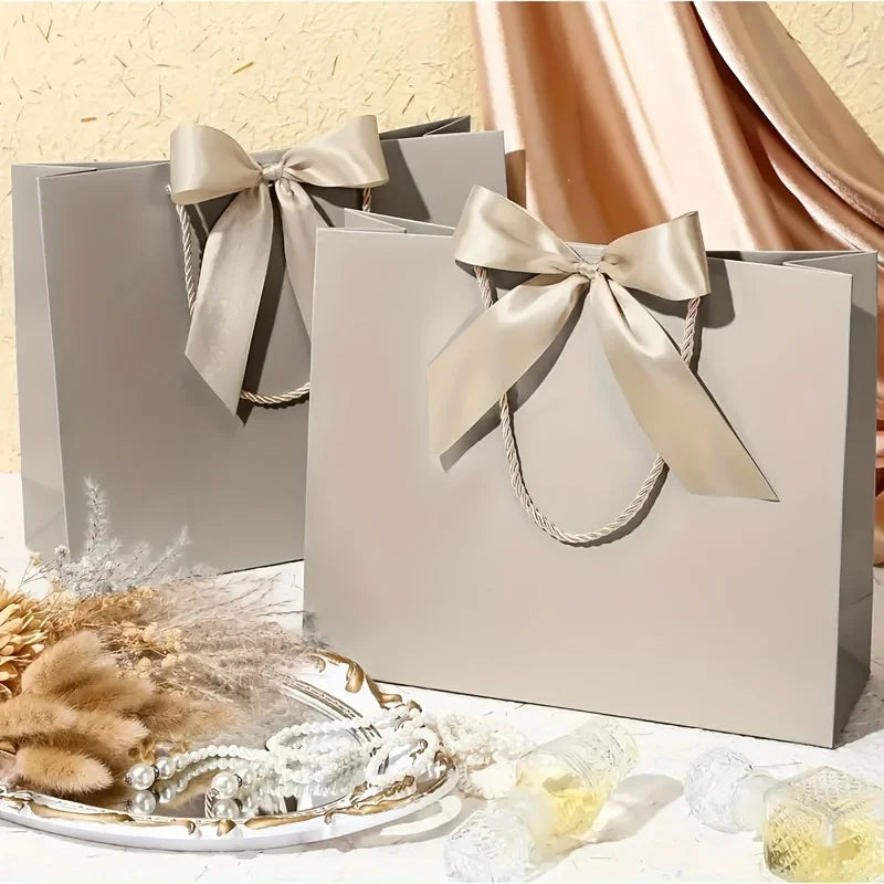 10 bolsas de regalo beige de "agradecimiento" con moños dorados – Elegantes bolsas de papel plegables para compras para recuerdos de bodas, regalos de fiestas y eventos