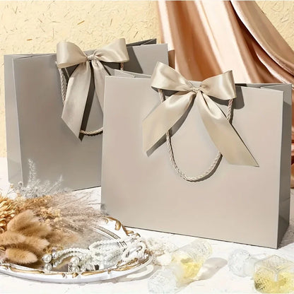 10 bolsas de regalo beige de "agradecimiento" con moños dorados – Elegantes bolsas de papel plegables para compras para recuerdos de bodas, regalos de fiestas y eventos