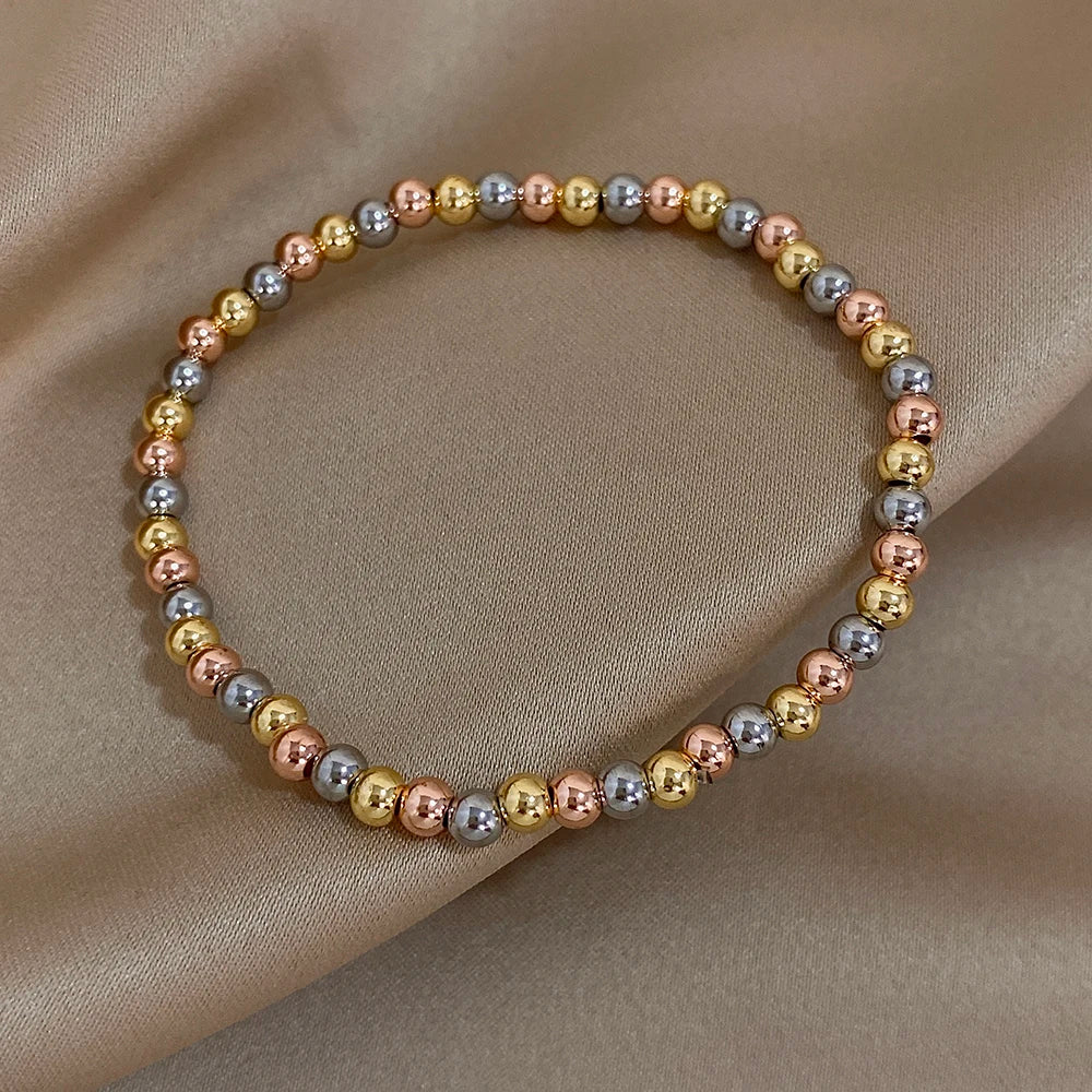 Pulsera de cuentas de acero inoxidable Greatera – Pulsera de cadena elástica tricolor bañada en oro de 3/4 mm para mujer | Regalo de joyería de moda impermeable