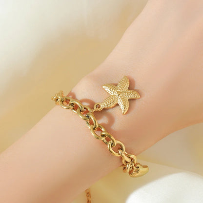 Pulsera de acero inoxidable 316L con dijes de estrellas de mar, luna y estrellas doradas – Cadena de muñeca moderna para mujer, regalo de joyería para fiestas