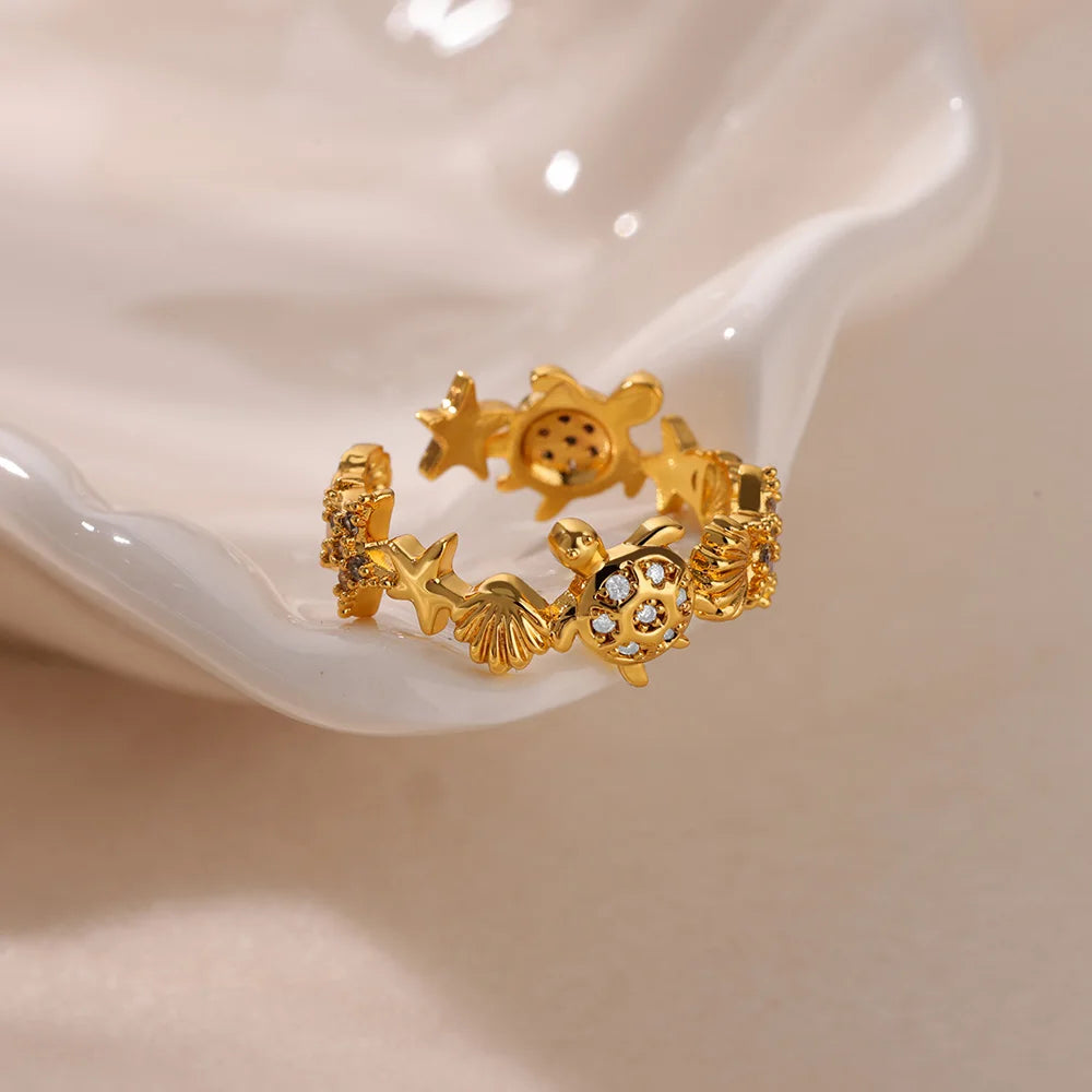 Gold Stainless Steel Starfish & Shell Ring – Adjustable Waterproof Beach-Inspired Ring for Women