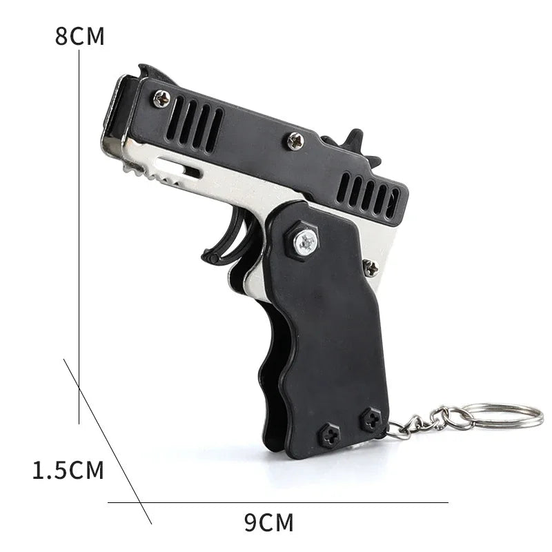 Llavero de pistola de goma de metal - Mini pistola de juguete de aleación con 60 gomas elásticas para juegos al aire libre, diversión en fiestas y regalos