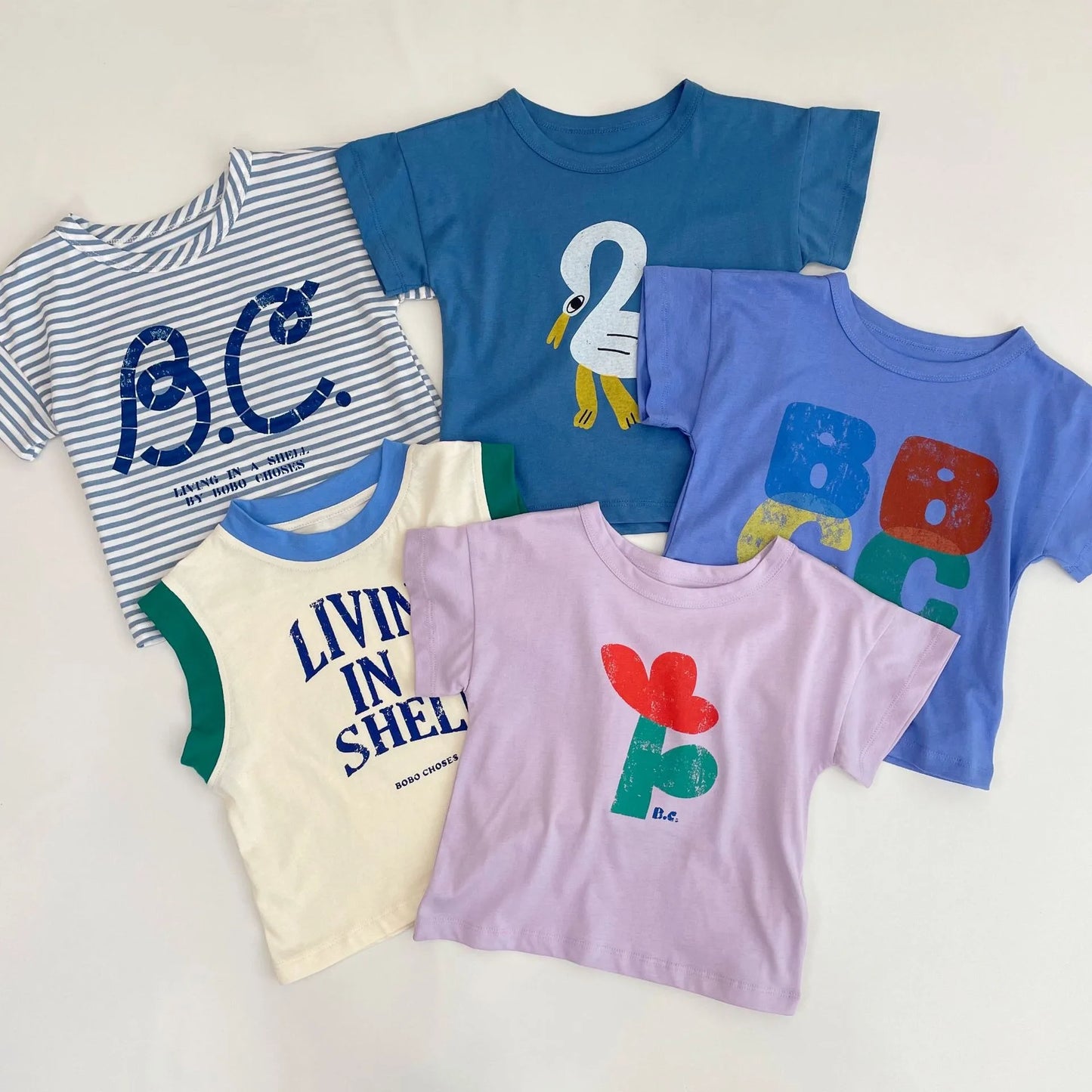 Camiseta de algodón con dibujos animados para niños 2025 – Top de manga corta estilo coreano de primavera-verano para bebés niños y niñas, ropa exterior informal para uso diario.