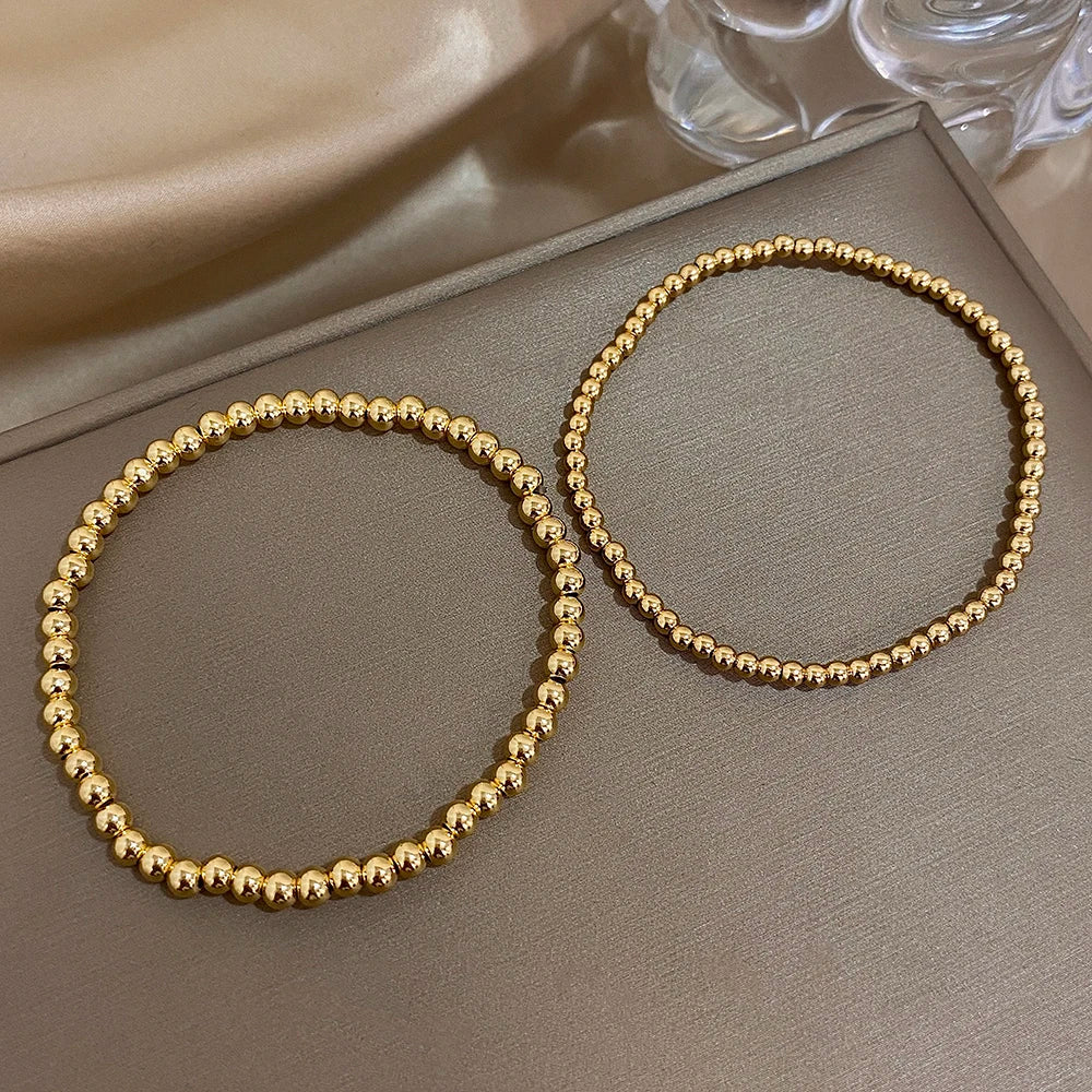 Pulsera de cuentas de acero inoxidable Greatera – Pulsera de cadena elástica tricolor bañada en oro de 3/4 mm para mujer | Regalo de joyería de moda impermeable