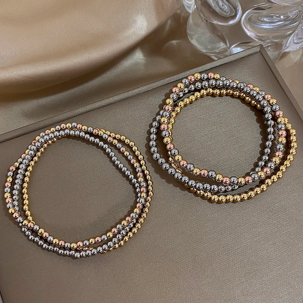 Pulsera de cuentas de acero inoxidable Greatera – Pulsera de cadena elástica tricolor bañada en oro de 3/4 mm para mujer | Regalo de joyería de moda impermeable