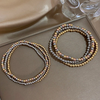 Pulsera de cuentas de acero inoxidable Greatera – Pulsera de cadena elástica tricolor bañada en oro de 3/4 mm para mujer | Regalo de joyería de moda impermeable