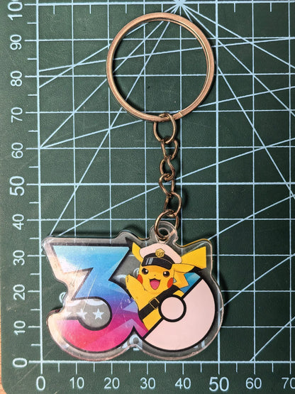 Pokémon 30th Anniversary Acrylic Keychain – Captain Pikachu, Eevee & Eeveelutions (50 Styles)