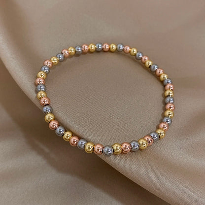 Pulsera de cuentas de acero inoxidable Greatera – Pulsera de cadena elástica tricolor bañada en oro de 3/4 mm para mujer | Regalo de joyería de moda impermeable