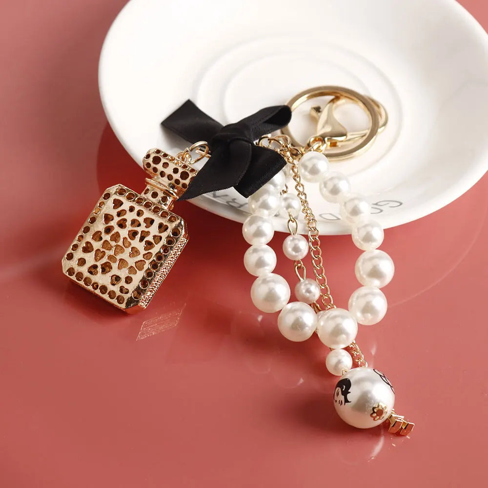 Imitation Pearl Perfume Bottle Keychain – Cute Bow Car Key Ring & Fashion Bag Charm Accessory for Women and Girls