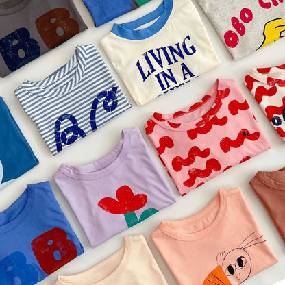 Camiseta de algodón con dibujos animados para niños 2025 – Top de manga corta estilo coreano de primavera-verano para bebés niños y niñas, ropa exterior informal para uso diario.