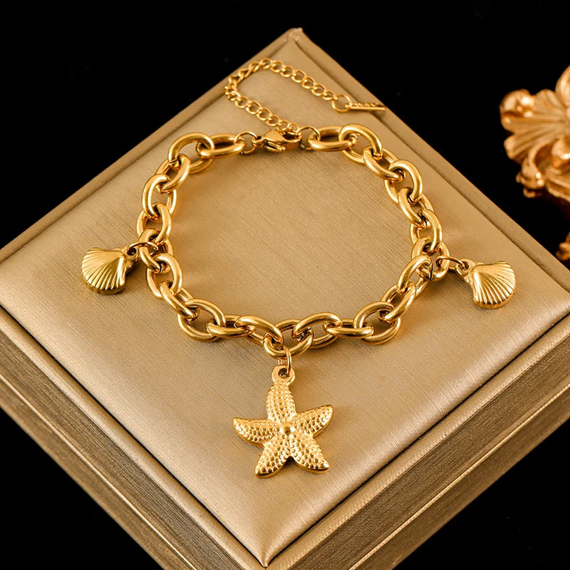 Pulsera de acero inoxidable 316L con dijes de estrellas de mar, luna y estrellas doradas – Cadena de muñeca moderna para mujer, regalo de joyería para fiestas