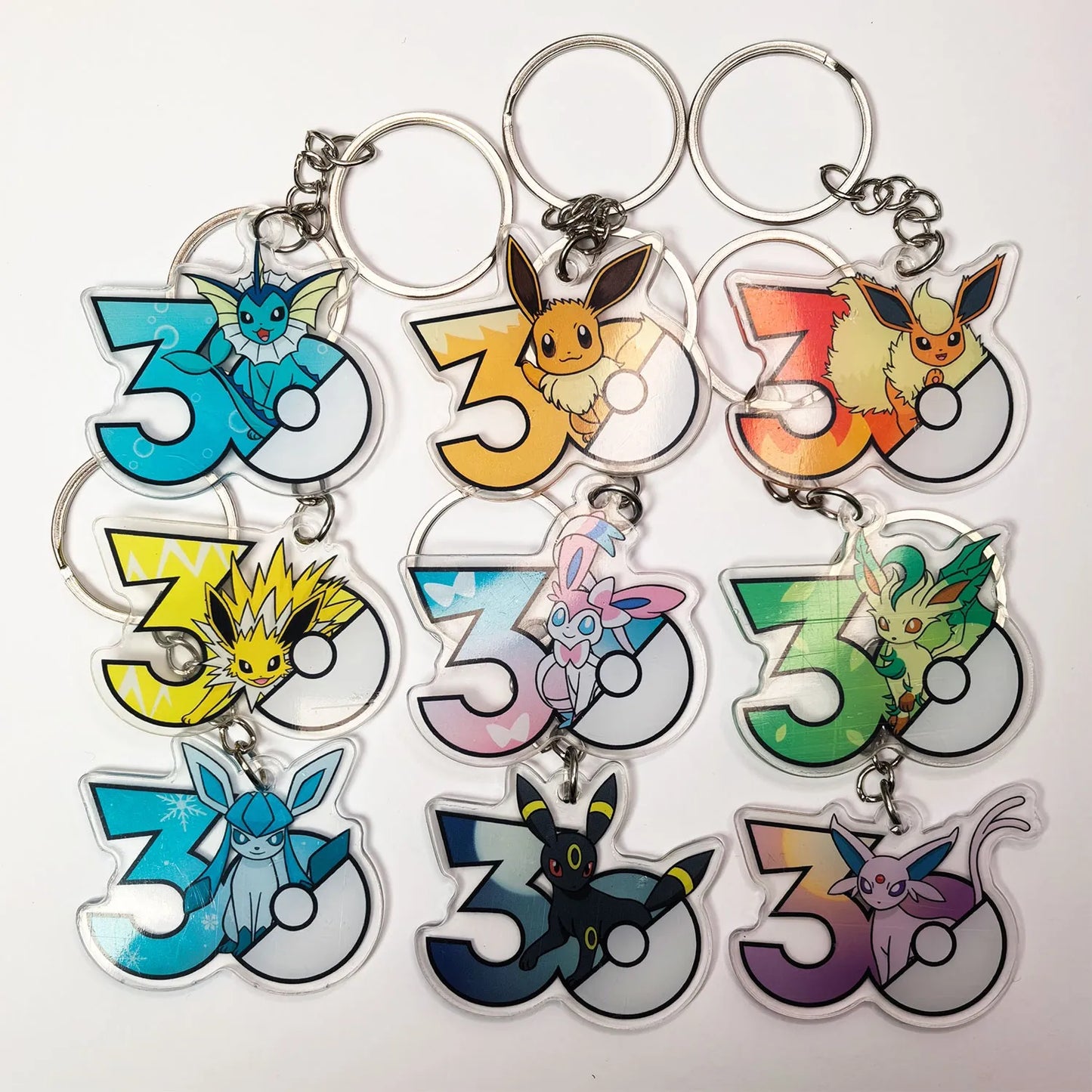 Pokémon 30th Anniversary Acrylic Keychain – Captain Pikachu, Eevee & Eeveelutions (50 Styles)