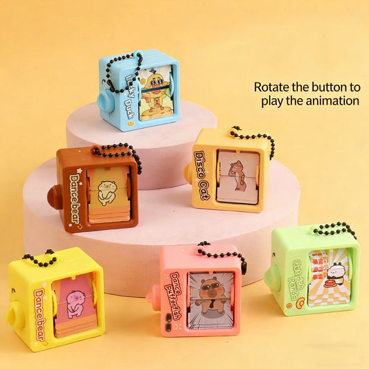 Porte-clés machine d'animation à bascule pour livre de dessins animés – Pendentif de sac à dos créatif, jouet Fidget de décompression, petit cadeau original
