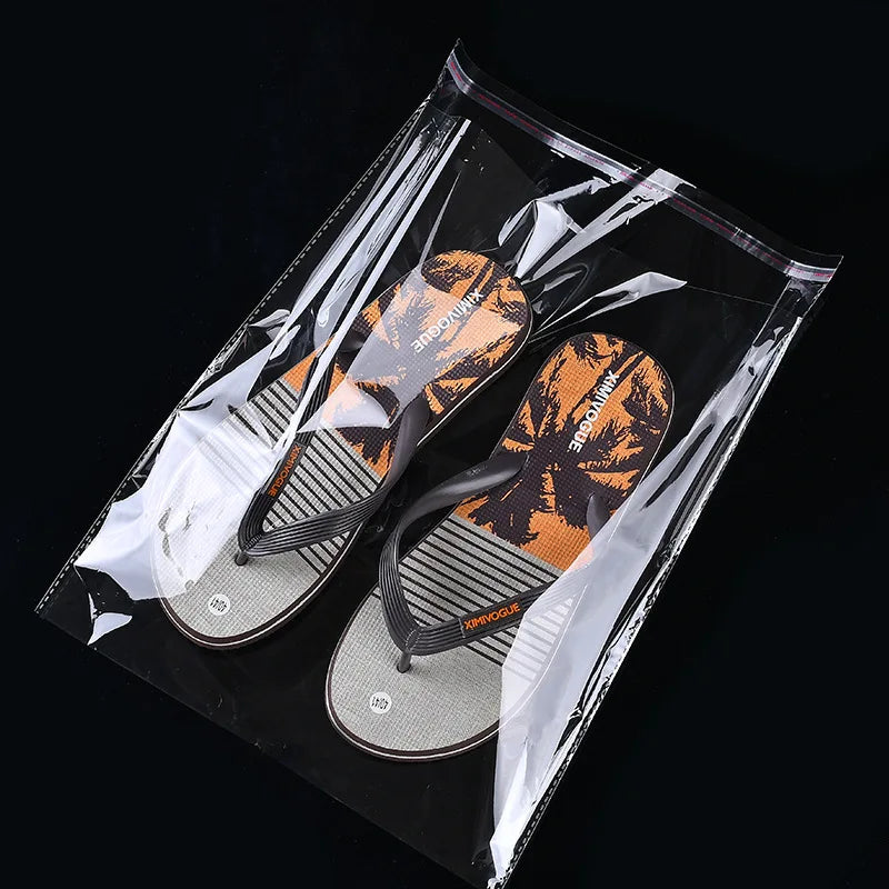 StoBag 100 sacs auto-scellants transparents pour vêtements – Sacs d'emballage en plastique transparent avec fermeture adhésive pour t-shirts, cadeaux, mariages et fêtes