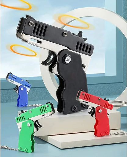 Llavero de pistola de goma de metal - Mini pistola de juguete de aleación con 60 gomas elásticas para juegos al aire libre, diversión en fiestas y regalos