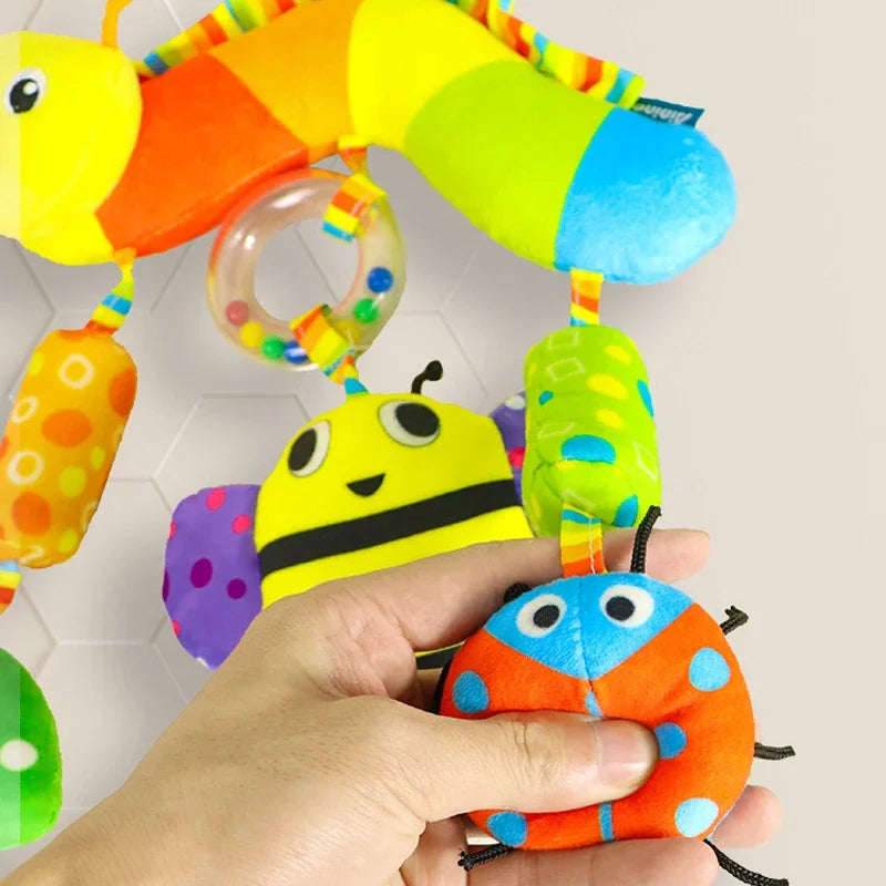 Peluche de actividades "Bebé Arcoíris" – Juguete sensorial colgante para cochecito para 0-12 meses, juguete móvil para asiento de coche y cuna, juguete de viaje suave y educativo para el desarrollo y juego del recién nacido.