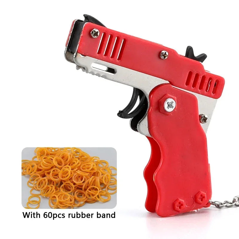 Llavero de pistola de goma de metal - Mini pistola de juguete de aleación con 60 gomas elásticas para juegos al aire libre, diversión en fiestas y regalos